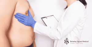 doctor assessing tubular breasts