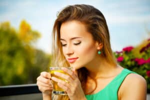 Young Woman Drinking Green Tea