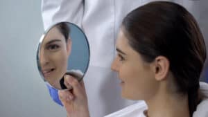 young woman after septorhinoplasty recovery
