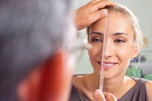 young woman and doctor during consultation before septoplasty