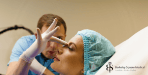 surgeon doing revision rhinoplasty consultation